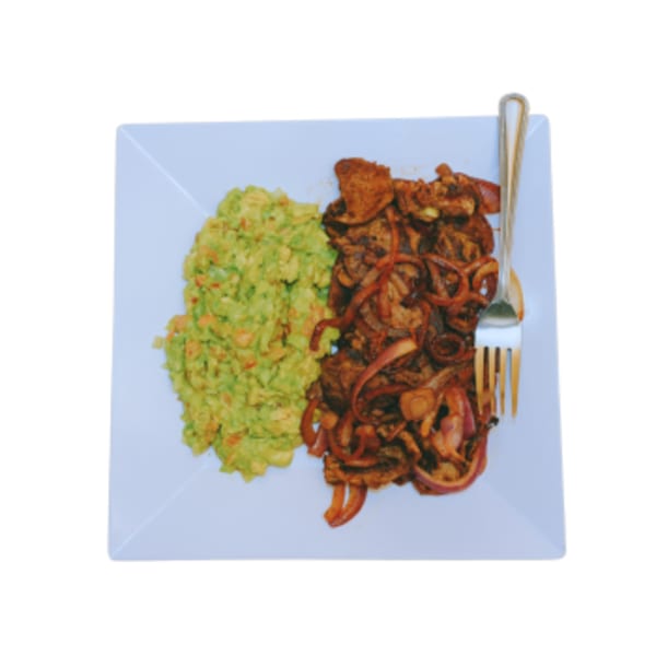 Manna Bistro's Ethiopian dish with seasoned meat, red onions, and a side of guacamole.